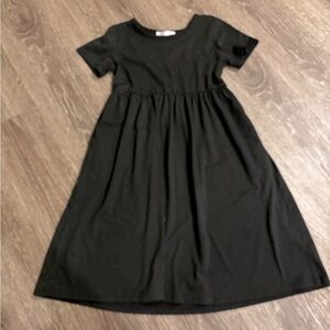 Adorable black girls size 11/12 dress with pockets.